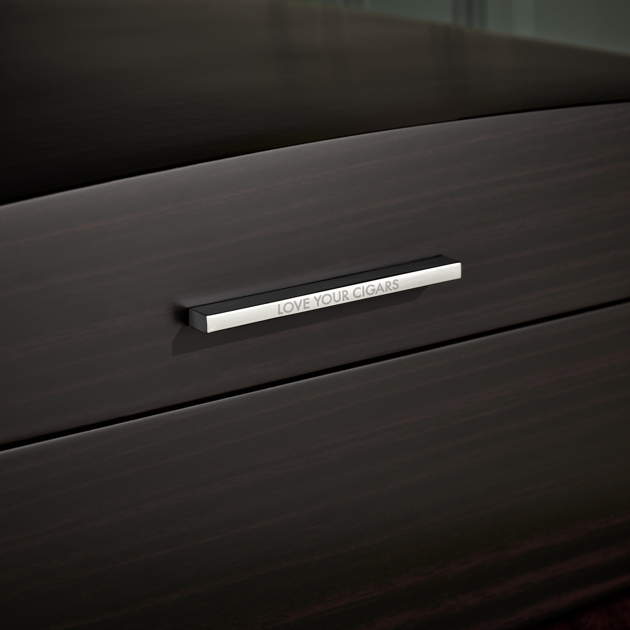 Close up shot to "Love Your Cigars" engraved on the Boveda Humidor Handle