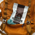 Boveda Fresh bag sitting in the pocket of a backpack.
