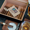 Boveda size 60 69RH in a wood humidor with cigars.