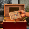 Person placing a Boveda size 320 onto a Boveda mounting plate in a humidor.