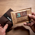 Boveda 49% RH being removed from plastic overwrap.